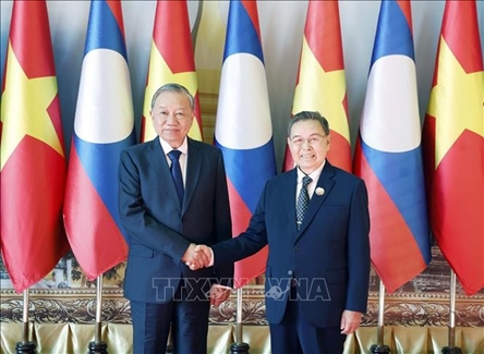 Party leader meets Lao N.A. Chairman in Vientiane
